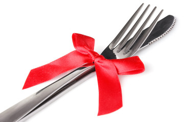 Cutlery - a fork and knife stacked up on a white background