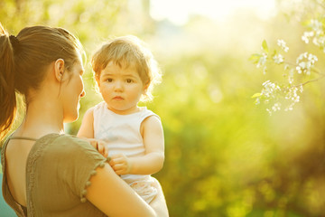 Mother and her child enjoy the early spring