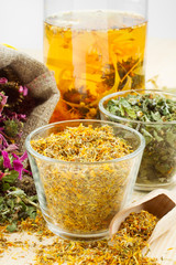 healing herbs and healthy tea on wooden table, herbal medicine