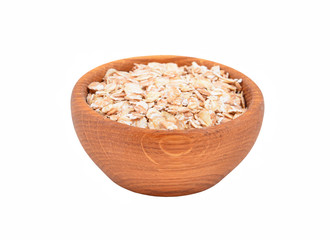 Oatmeal in a wooden bowl, isolated on white background