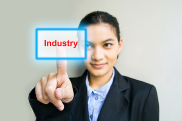 business woman hand pushing Industry button