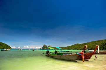Traditional boat at pristine thailand beach