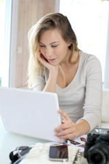 Woman working at home on laptop computer