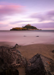 St. Michaels Mount with rocks at dusk, Cornwall, England