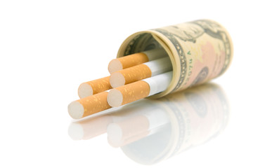 Cigarettes in U.S. dollars on a white background