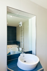 interior bathroom in modern house, sink and mirror