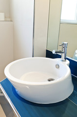 interior bathroom in modern house, sink and mirror