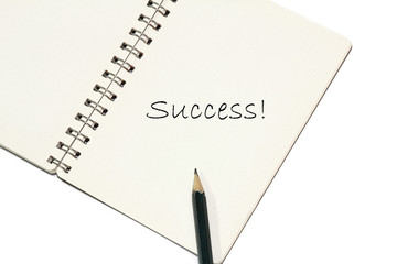 pencil writing success on a book