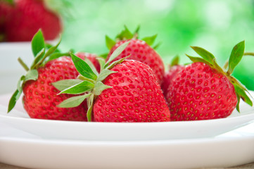 Strawberries on white plate