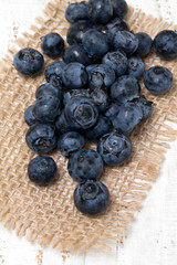 blueberry on sackcloth on wooden table