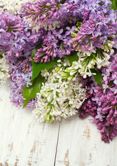lilac flowers on wooden table