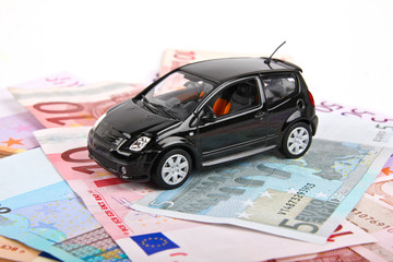 Car standing on Euro bills
