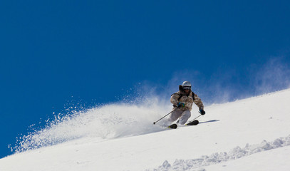 Naklejka na ściany i meble Skier in deep snow