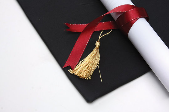 Mortar Board And The Roll Of Diploma