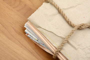 Paper pile tied up by a rope