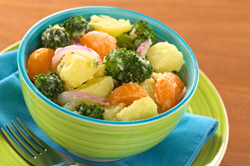 Potato, broccoli, mandarin and onion salad with mayonnaise
