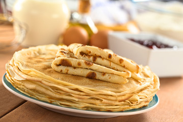 Fresh homemade crepes on plate with ingredients