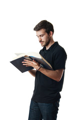 Man reading from a large book