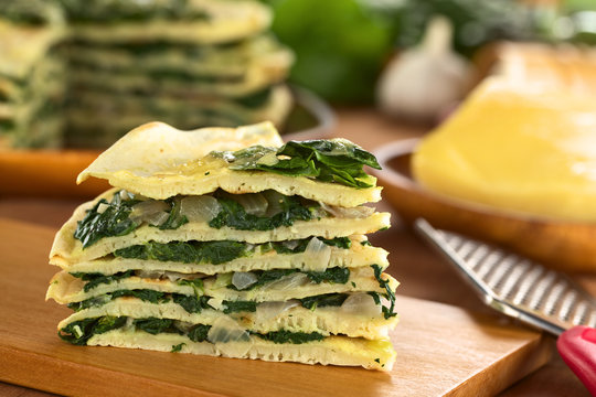 A piece of savory crepes layered with chard (mangold)