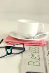 Glasses  and newspaper