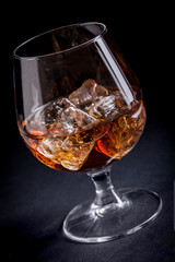 Whiskey / Cognac on black background