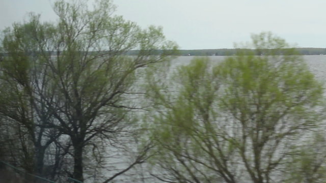 Lake view from the window of high-speed train