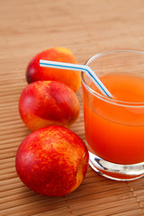 fresh juice in a glass and peaches