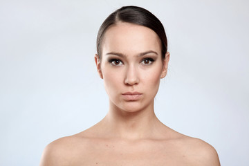 Beautiful young female face with a wellness complexion