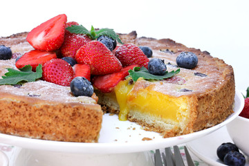 Sweet cake with berries and citrus stuffing