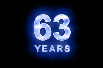 63 Years in glowing white numbers on blue