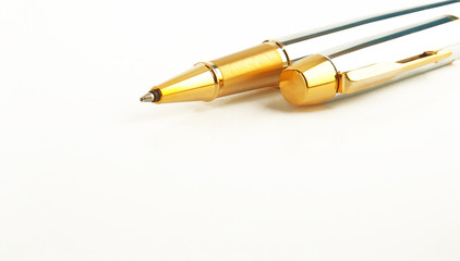 Gold ballpoint isolated on background white