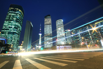 Fototapeta na wymiar Shanghai modern landmark buildings background car night light tr
