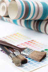 Paintbrushes, wallpapers, and color swatch