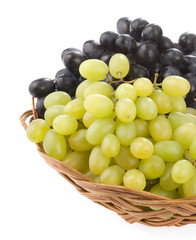 fresh grape fruits and wicker basket plate