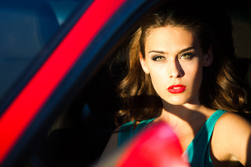 Fototapeta na wymiar woman in red car