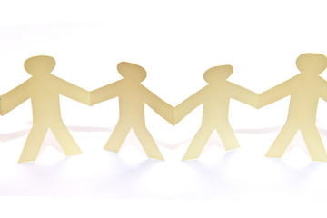 Cutout paper people over white background