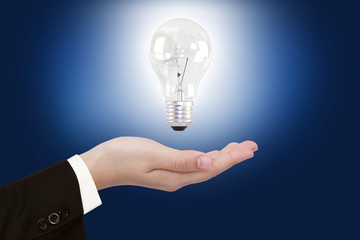 women hand with Light bulb