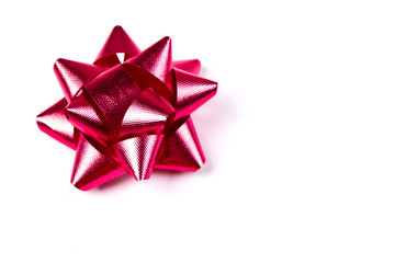 Bright red bow isolated over white background