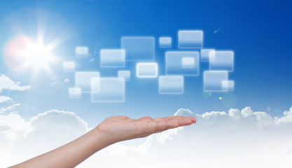 Hand and button on blue sky