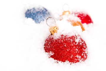 Blue ,red and gold christmas balls with snow