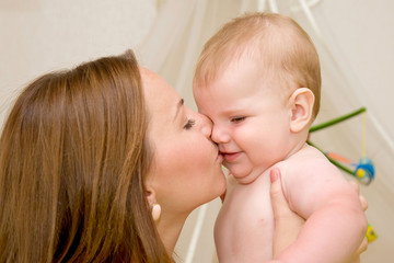 Portrait of a beautiful happy mother with baby