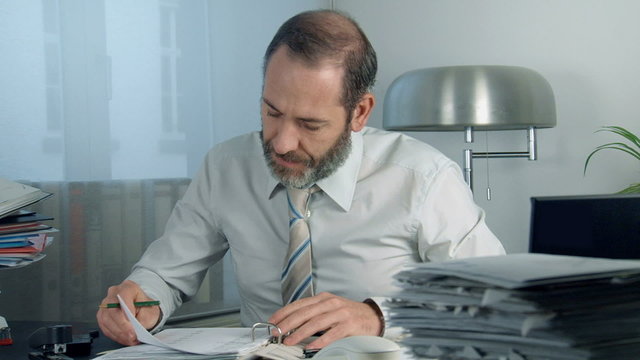 Business man at work - tracking shot