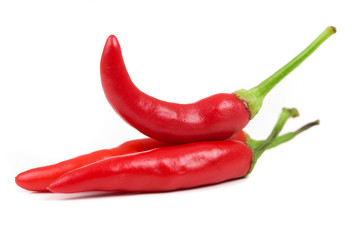 three red hot chili pepper isolated on a white background