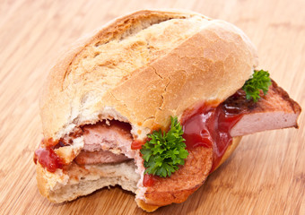 Roll with meat loaf on wood