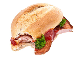 Bitten off meat loaf roll isolated on white