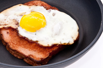 Meat loaf and fried egg in a skillet