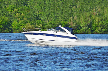 Fototapeta premium Motorboat on the Dnieper river, Kiev, Ukraine