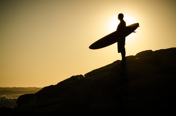 A surfer watching the waves