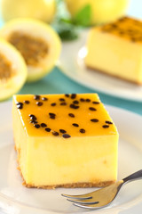 Fresh passion fruit cheesecake dessert on plate