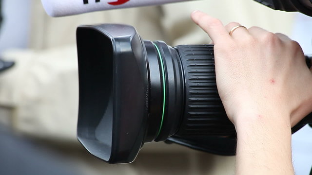 Cameraman with camera (close up)